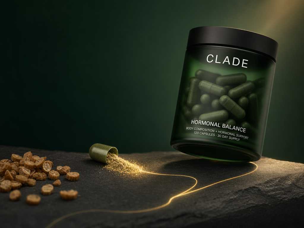 CLADE Hormonal Balance jar on slate with an opened capsule spilling golden Torabolic powder: visualizing the AMPK activation story